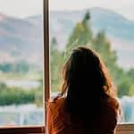 Woman Wearing Brown Shirt Inside Room